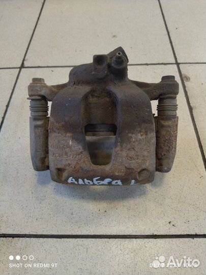 Суппорт тормозной передний левый Fiat Albea