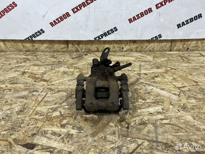 Суппорт тормозной задний левый Skoda Octavia A5