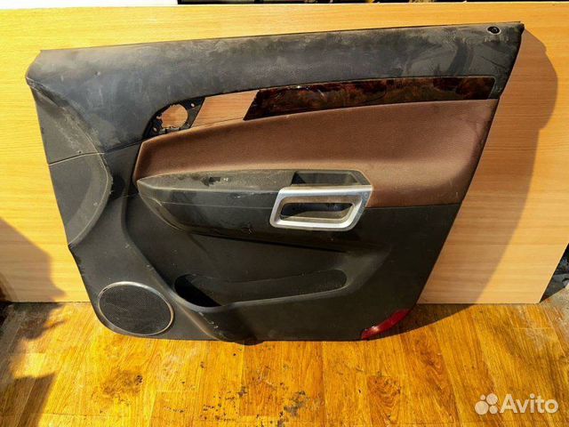Обшивка двери передней правой Opel Antara
