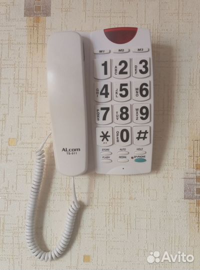 Кнопочный стационарный телефон