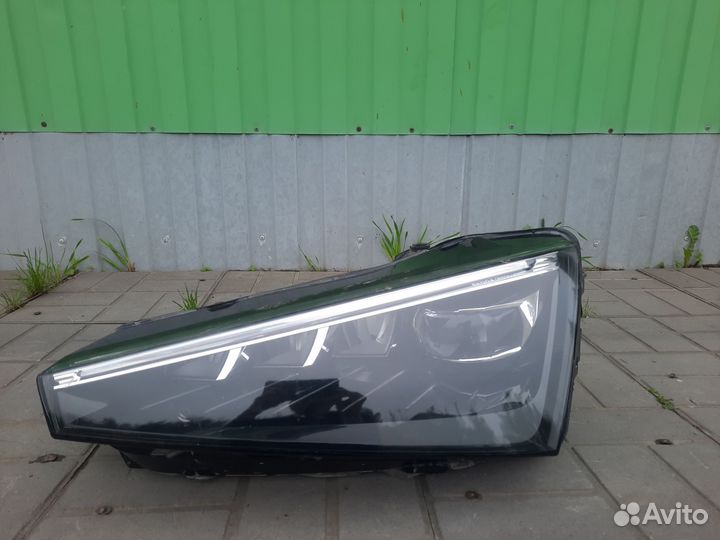 Фара левая Skoda Rapid