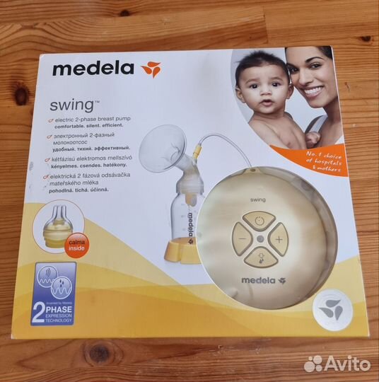 Молокоотсос medela электрический