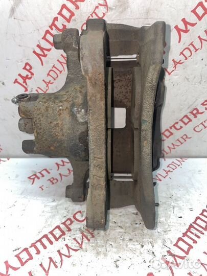 Суппорт тормозной передний левый Mitsubishi Lancer