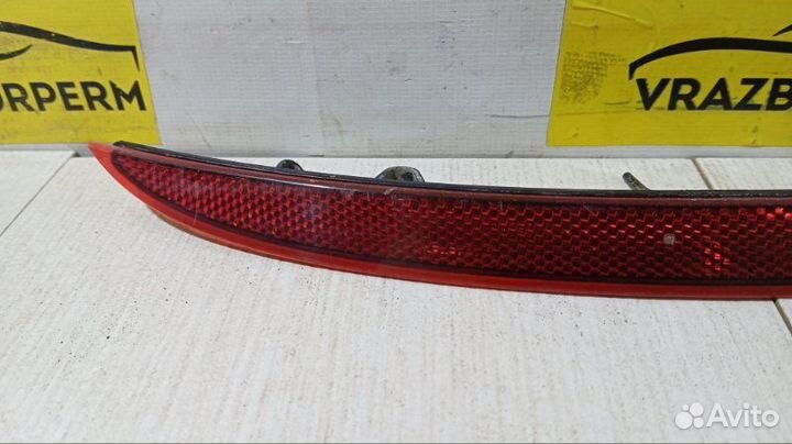 Отражатель в бампер задний правый Opel Astra J