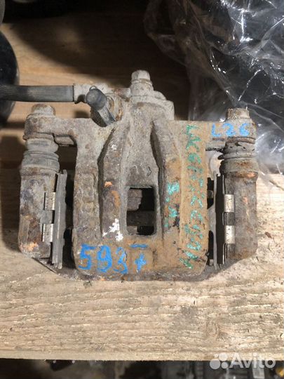 Суппорт тормозной задний левый Chevrolet Lacetti