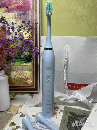 Электрическая зубная щетка