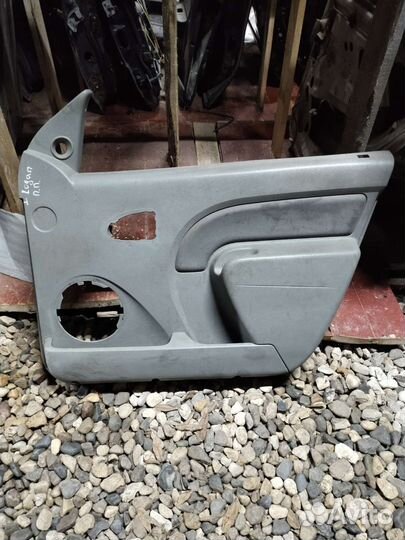 Обшивка двери передней правой Renault Logan