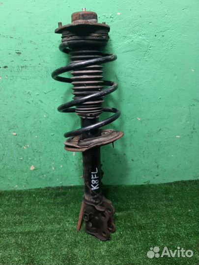 Стойка амортизатора передняя левая KIA Sportage 3