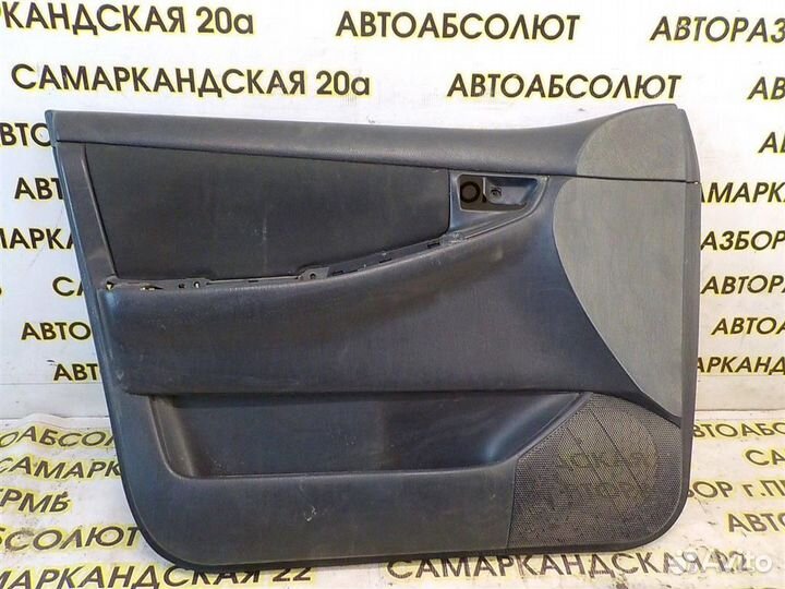 Обшивка двери передней левой Toyota Corolla (E120