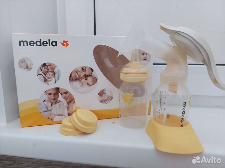 Молокоотсос medela ручной + пакеты для хранения