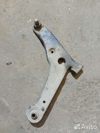 Лансер 9 передний левый рычаг