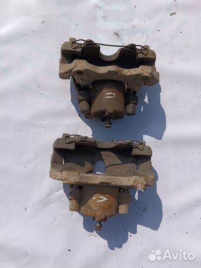 Суппорт тормозной передний левый Опель астра h