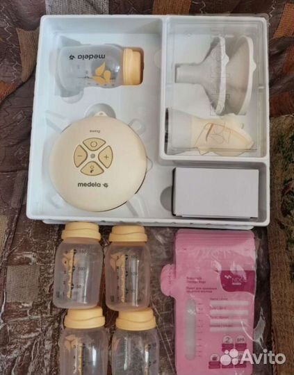 Молокоотсос medela электрический