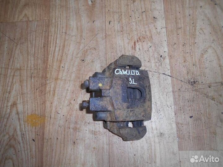 Суппорт задний левый Jeep Grand Cherokee WJ (1998