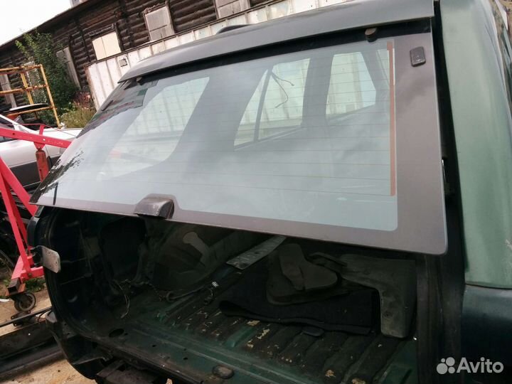 Опель Фронтера Стекло заднее