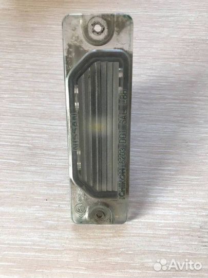 Фонарь подсветки номера Nissan Almera