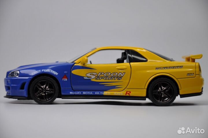 Модель авто Nissan Skyline GT-R R34 1:32 металл