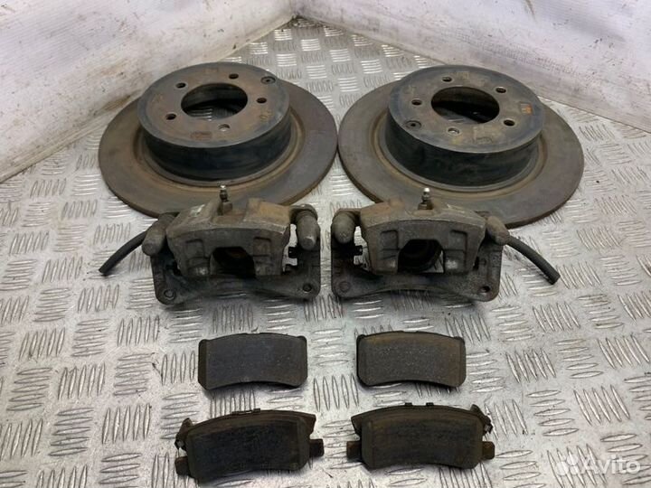 Суппорт тормозной задний Mitsubishi Lancer 10 4B11