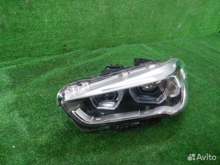 Фара левая BMW X1