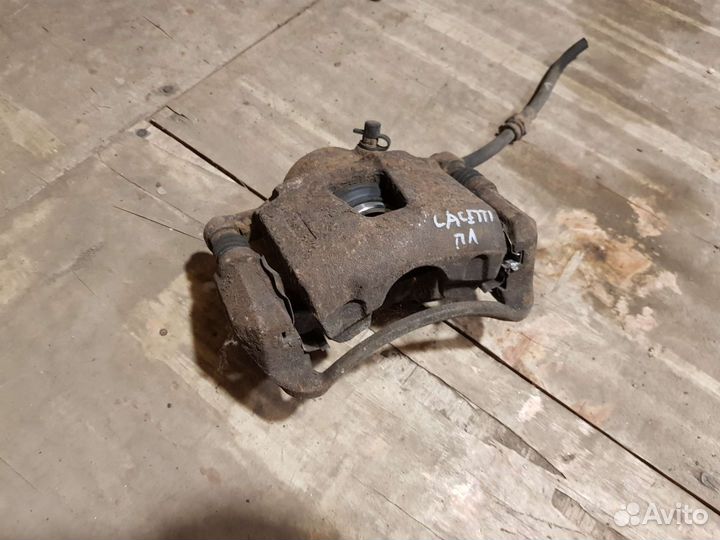 Суппорт тормозной передний Chevrolet lacetti