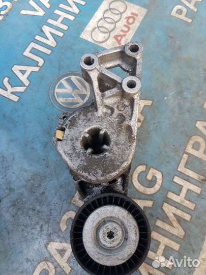 Натяжитель обводного ремня golf 4 1.6.06A903315E