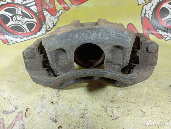 Суппорт тормозной передний левый Kia Rio 2 2010
