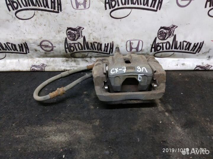 Суппорт задний левый Mazda Cx-7 2.3