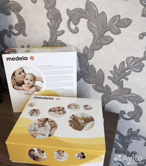 Молокоотсос medela электрический