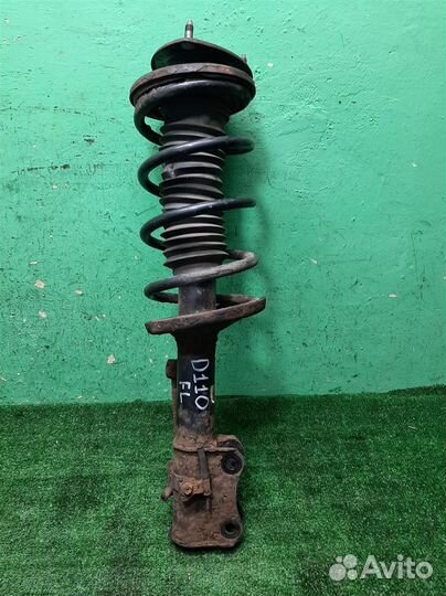 Стойка амортизатора передняя левая Suzuki Grand V