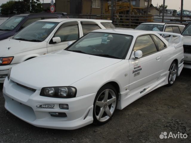 Передний бампер C-West на Nissan Skyline R34