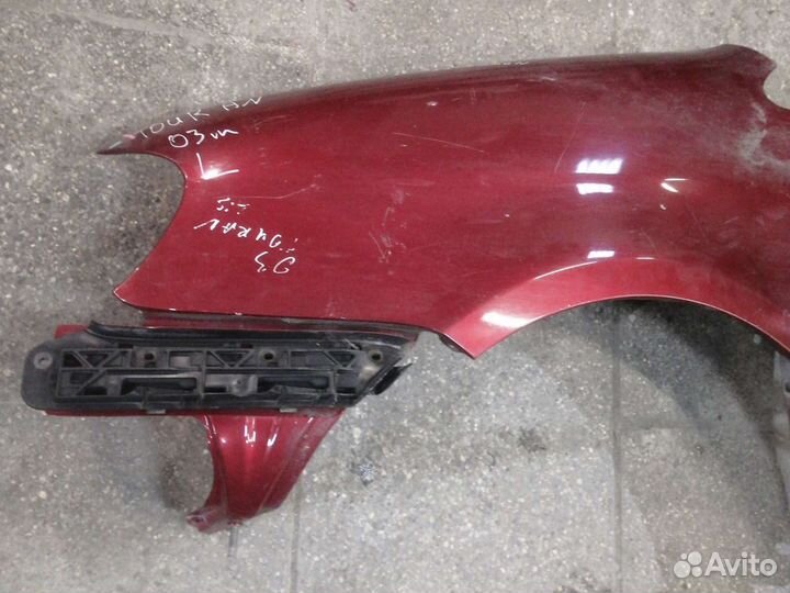 Кронштейн левого крыла Volkswagen Touran