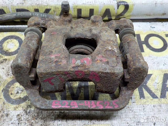 Суппорт задний левый Nissan Tiida (C11) 2004-2014