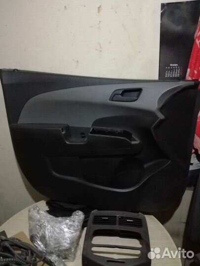 Обшивка двери шевроле авео т300