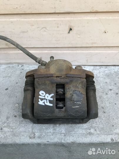 Суппорт передний правый Renault Logan 7701201770