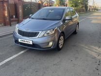 Kia Rio 1.6 AT, 2011, 217 000 км, с пробегом, цена 857 000 руб.