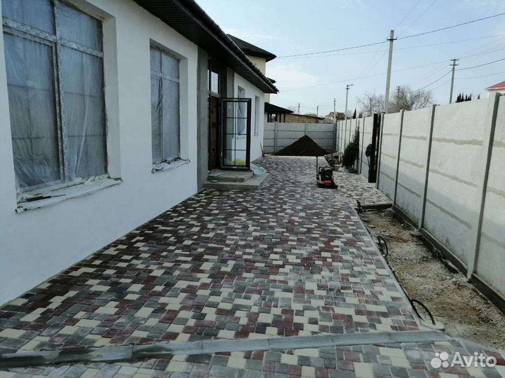 Укладка тротуарной плитки брусчатки