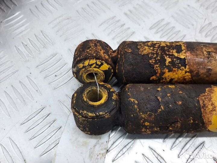 Амортизатор задний левый Ford Focus рест. 2003