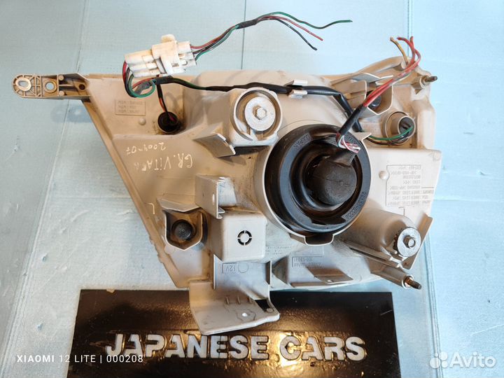 Фара сторона L Suzuki Grand Vitara