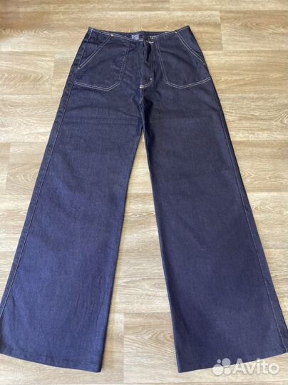 Джинсы клеш от бедра 44-46