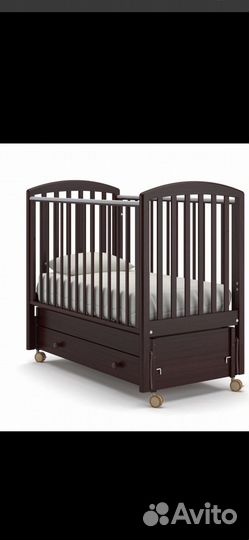 Детская кроватка с продольным маятником