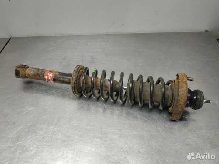 Стойка амортизатора задняя левая Mitsubishi