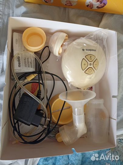 Молокоотсос medela электрический