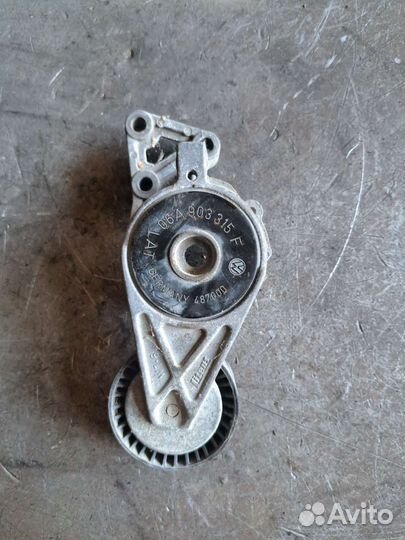 Натяжитель ремня на Volkswagen Passat B6