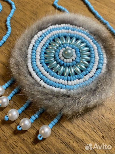 Нагрудное украшение солнышко из бисера