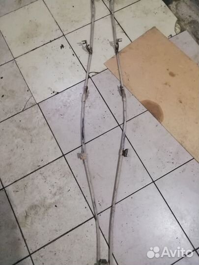 Трос стояночного тормоза Nissan Primera P12