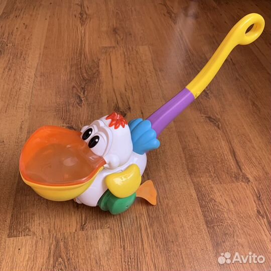 Каталка, музыкальная игрушка Пеликан