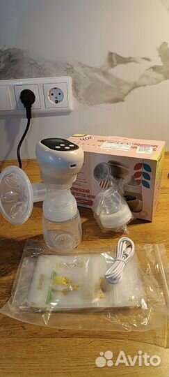 Молокоотсос электрический новый