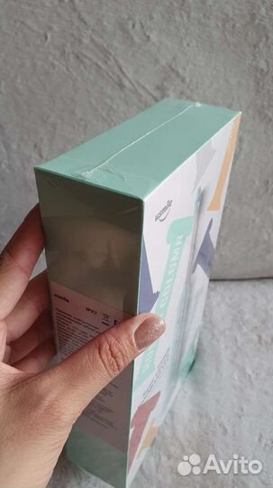 Электрическая зубная щетка