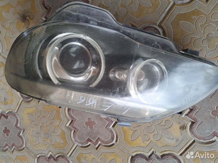 Фара левая BMW E65