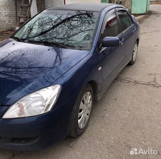 Дефлекторы на окна Lancer 9